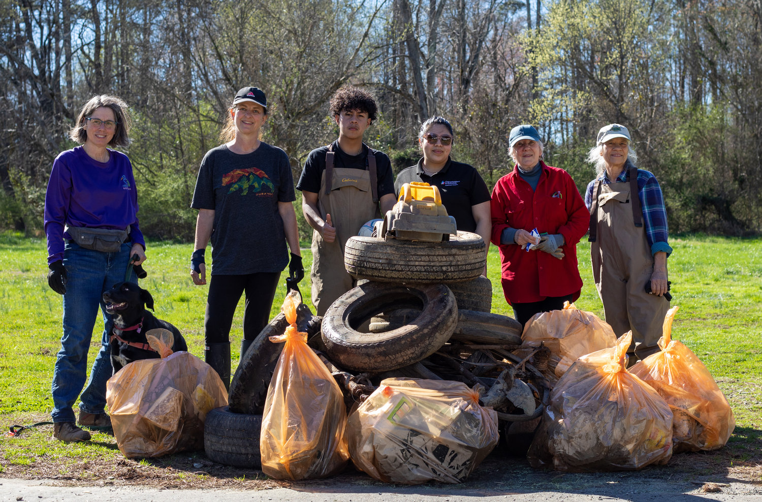 Bags of trash, tires, soccer balls, kids toys and even a bike were pulled out of Loves Creek by volunteers on Saturday during the trash clean up event.                      Shown from left: Catherine Deininger, Pascal Mittendorf, Marlon Interiano, Biesy Savilla, Diana Hales and Diana Montgomery